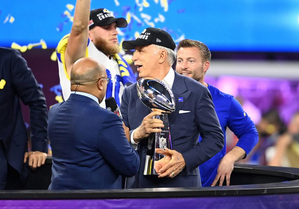 Stan Kroenke (R) receiving the Vice Lombardi trophy after the LA Rams Super Bowl triumph