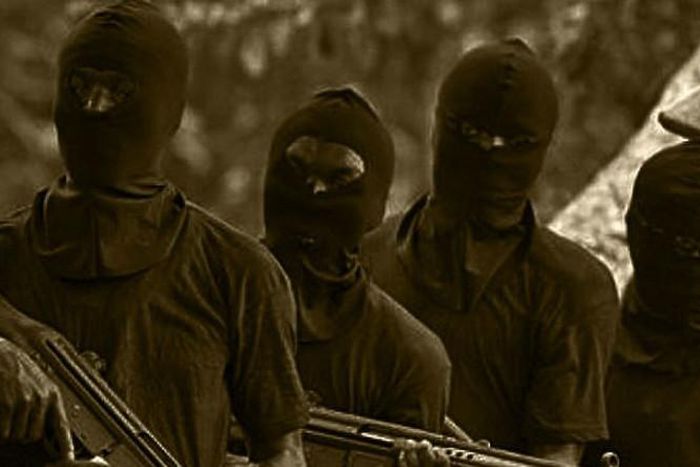 Unknown gunmen in face mask - Illustration purpose