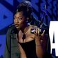 Tems accepting her award at the 2022 BET
