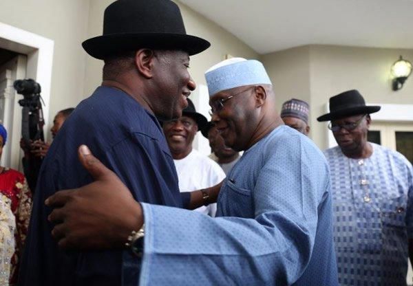 Former President Goodluck Jonathan and former Vice-President Atiku Abubakar in warm embrace.
