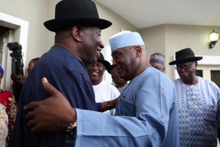 Former President Goodluck Jonathan and former Vice-President Atiku Abubakar in warm embrace.