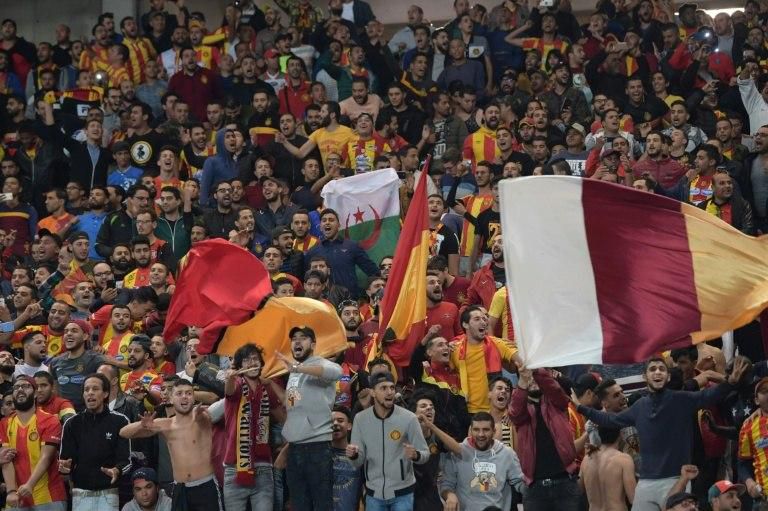 ES Tunis fans cheer for their team prior to the CAF Champions League second leg final football match between Egypt's Al-Ahly and Tunisia's ES Tunis at the Olympic stadium in Rades on November 9, 2018