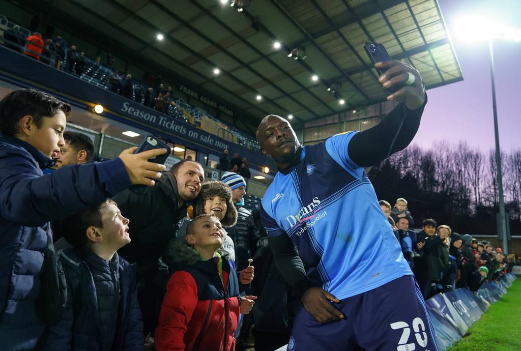 Akinfenwa taking a selfie with fans
