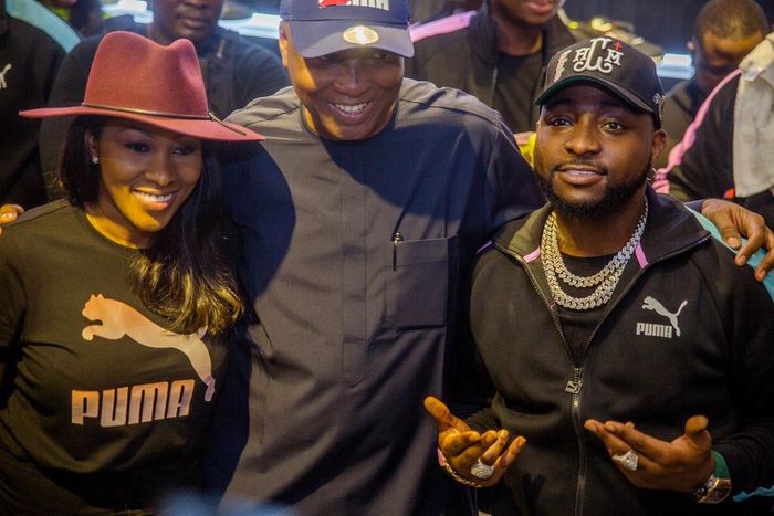 Ayo Amusan, Bukola Saraki and Davido at the launch of the store in Abuja