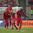 Equatorial Guinea players celebrate against Sierra Leone.