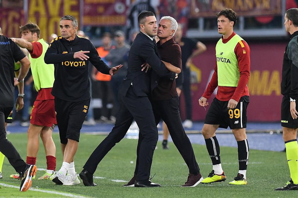 Jose Mourinho had to be physically restrained