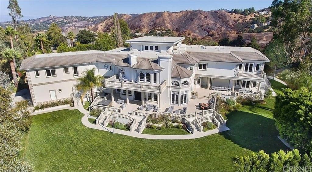 YouTube star Jake Paul's new mansion in Calabasas features massive rooms and a pool.