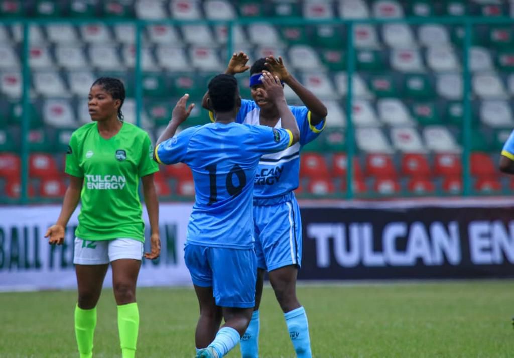 Monday Gift celebrates with one of her teammates in Benin.