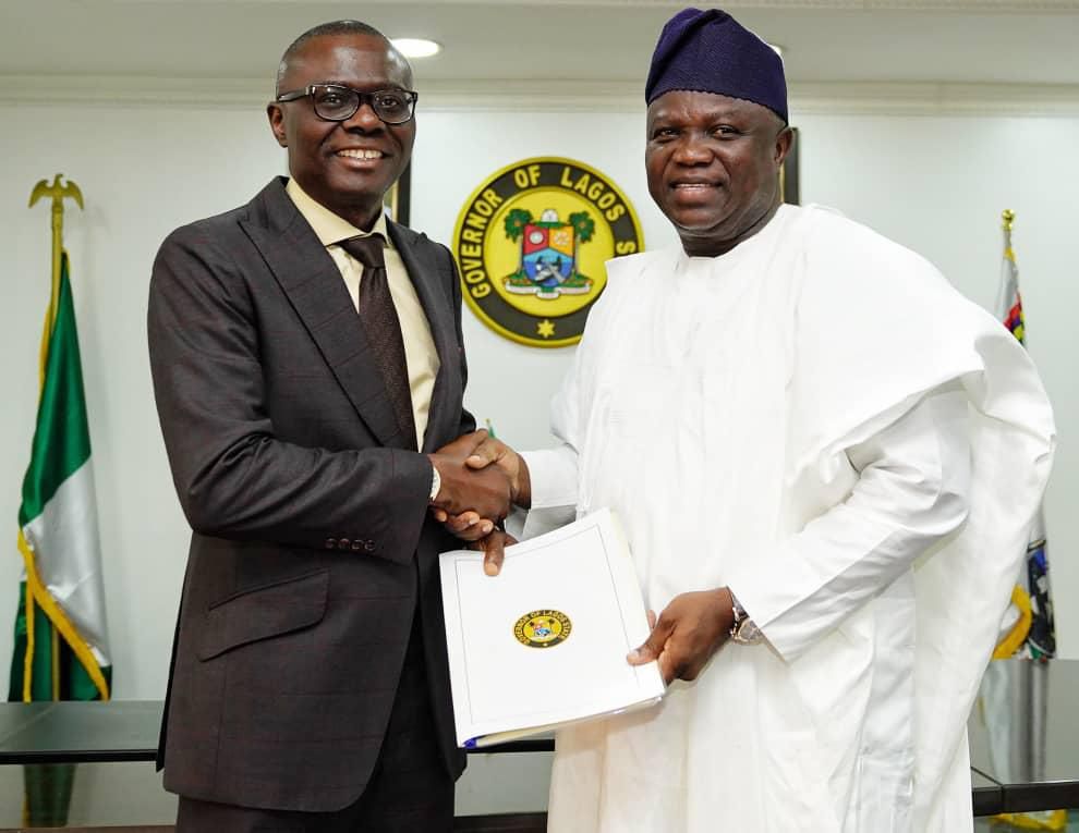 Babajide Sanwo-Olu shakes hands with Akinwunmi Ambode [Twitter/@jidesanwoolu]