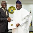 Babajide Sanwo-Olu shakes hands with Akinwunmi Ambode [Twitter/@jidesanwoolu]