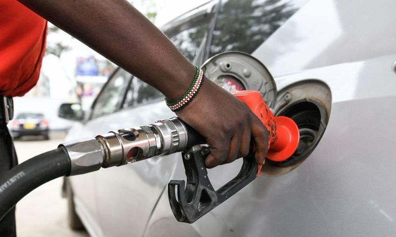 A pump attendant fills the tank of a car at a petrol station in September 4, 2018 in Nairobi as a 16 per cent VAT on petroleum products was decided and fuel distributors refused to collect stocks from depots. (Photo by SIMON MAINA/AFP via Getty Images)
