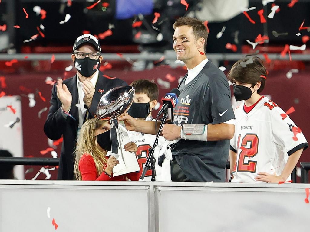 Tom Brady holds the Vince Lombardi Trophy after his Tampa Bay Buccaneers won Super Bowl LV.