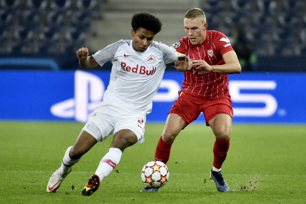 Germany forward Karim Adeyemi (L) scored three goals in the group stages to help Salzburg reach the last 16 of the Champions League