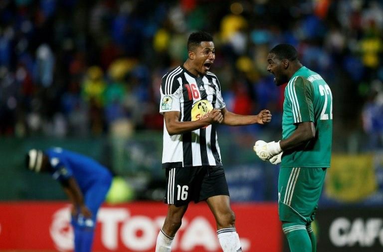 TP Mazembe duo Koffi Kouame (L) and Sylvain Gbohouo celebrate winning the 2017 CAF Confederation Cup