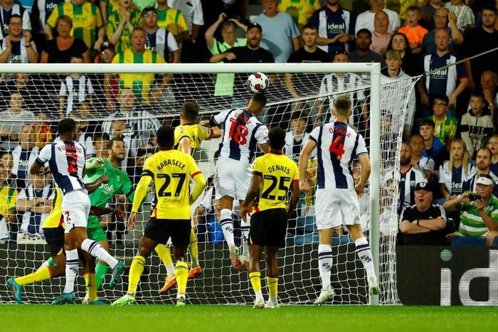 Karlan Grant heads at goal for West Brom against Watford as Emmanuel Dennis watches on.