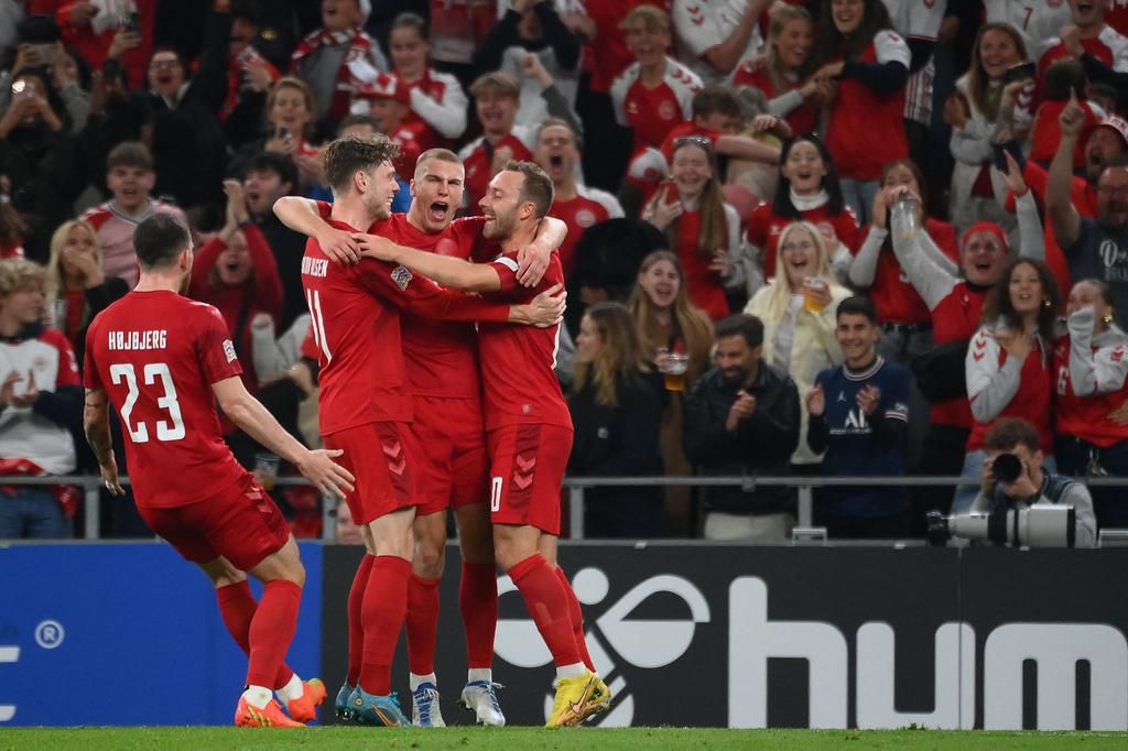 Denmark celebrates against France.