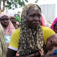 A woman breastfeeds her baby after being rescued from Boko Harm, near Mubi, northeast Nigeria October 29, 2015. REUTERS/Stringer