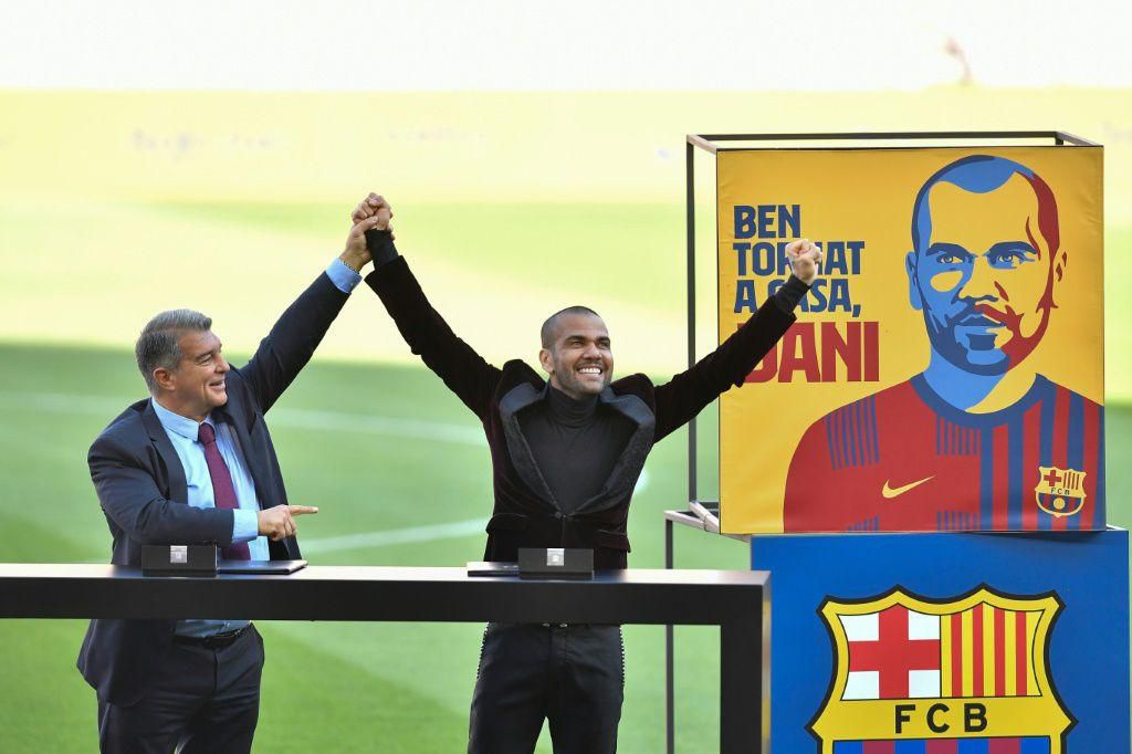 Dani Alves (right) was presented in front of Barcelona fans on Wednesday after making an incredible return to the club