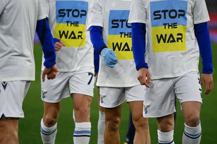 Lazio team players wear a 'Stop the war' T-shirts referring to Russia's invasion of the Ukraine as they arrive to warm-up prior to the Italian Serie A football match between Lazio and Napoli at the Olympic stadium, in Rome