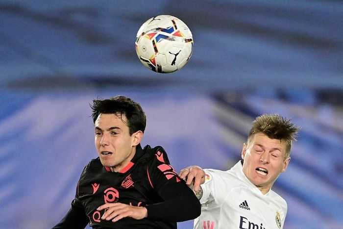 Toni Kroos (R) heads the ball with Real Sociedad's Spanish midfielder Martin Zubimendi during Monday's 1-1 draw