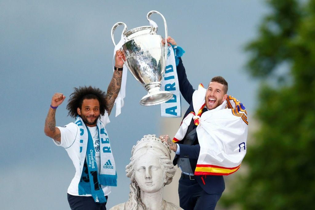 Ramos and Marcelo celebrate after an unprecedented third consecutive Champions League success in 2018, parading the trophy in Madrid's Cibeles square
