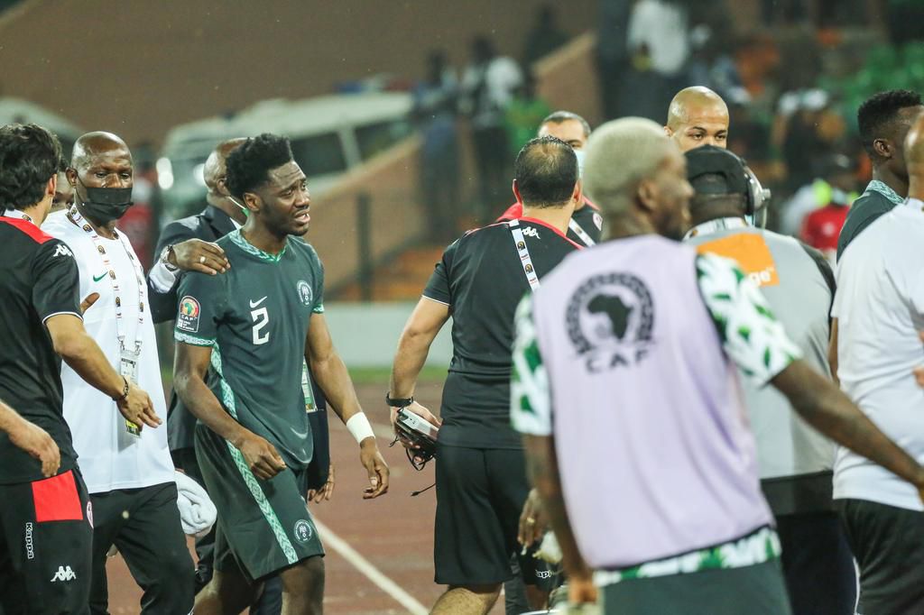 Super Eagles coaching staff consoling Ola Aina