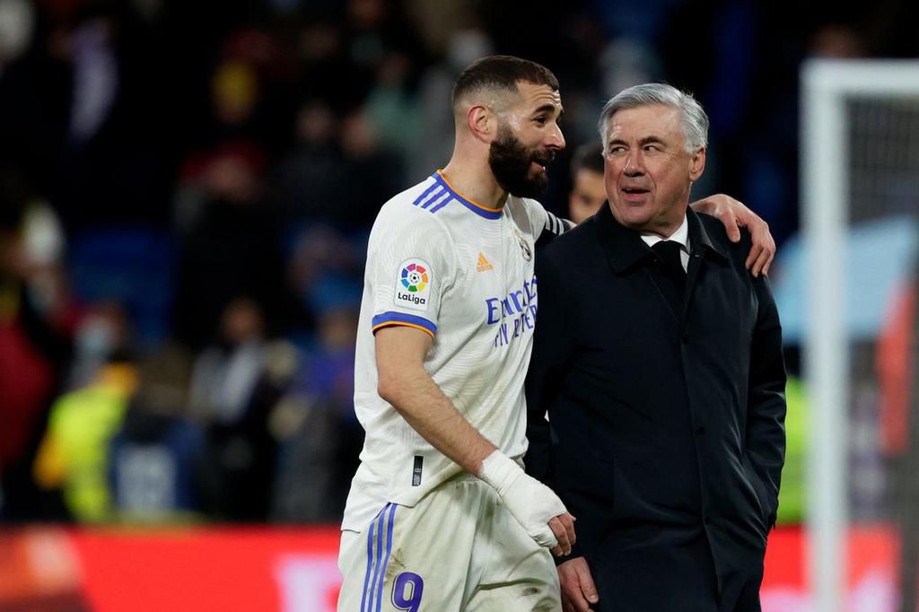 Karim Benzema and Carlo Ancelotti of Real Madrid.