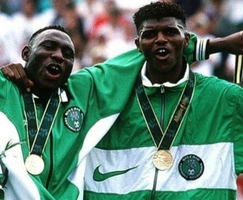 Daniel Amokachi celebrates his Olympic gold medal with Nwankwo Kanu