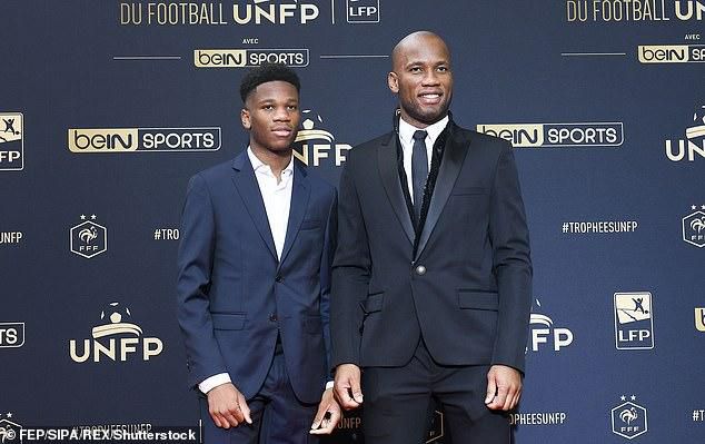 Isaac (L) and Didier Drogba (R)