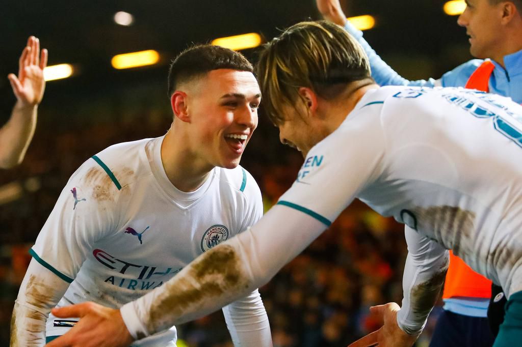 Phil Foden celebrates with Jack Grealish after the latter doubled the lead