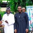 Former Super Eagles' captain Nwankwo Kanu (L) and Austin JJ Okocha presenting All Progressives Congress National Leader, Asiwaju Bola Tinubu, an award when the ex-internationals visited Tinubu in Ikoyi, Lagos on Saturday.
