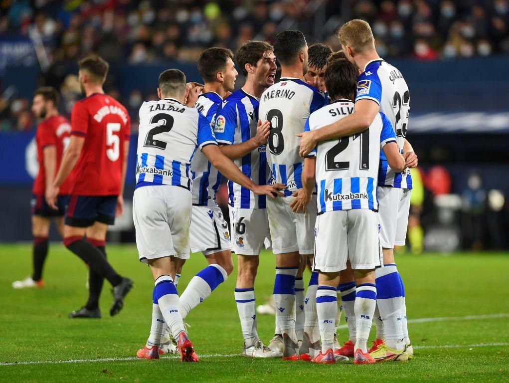 Real Sociedad players celebrate after Mikel Merino put them ahead against Osasuna