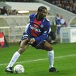 Then PSG midfielder Jay-Jay Okocha controls the ball during a French first division match at Parc des princes stadium in Paris, in 2000