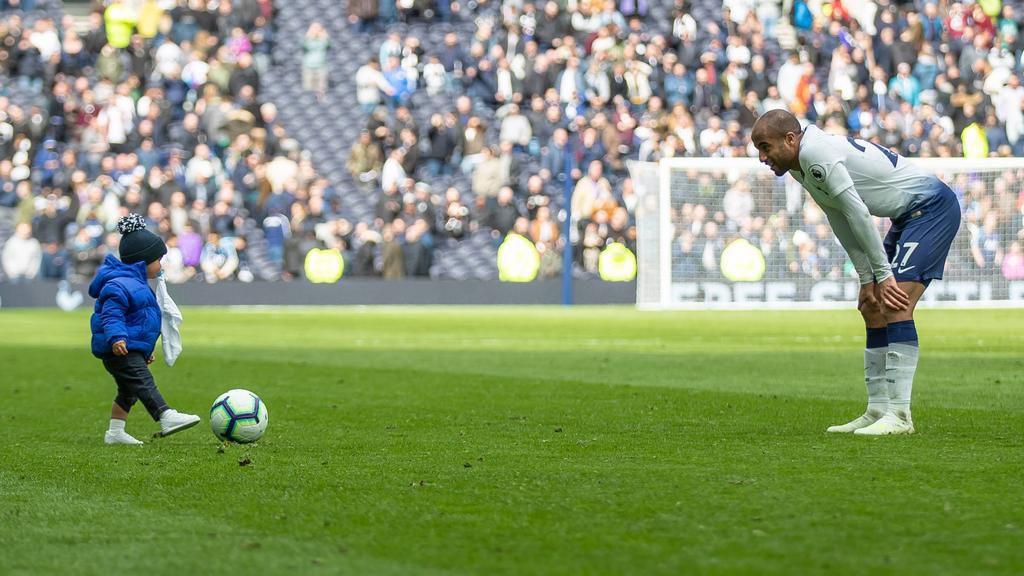 Lucas Moura enjoying a post-match kick about with his son