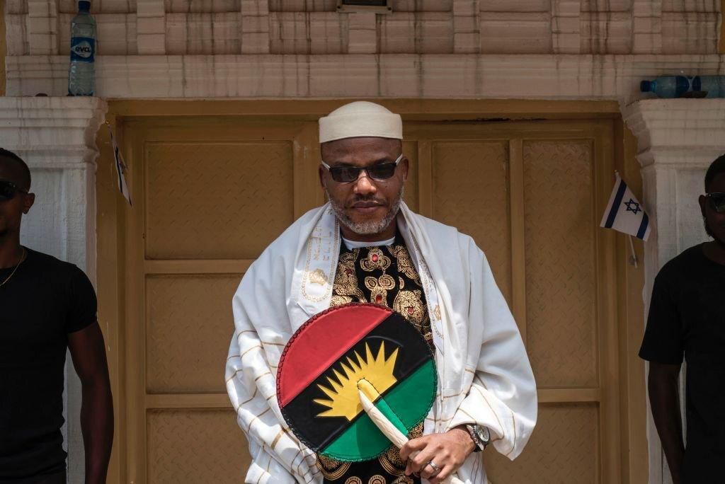 Political activist and leader of the Indigenous People of Biafra (IPOB) movement, Nnamdi Kanu (L), wearing a Jewish prayer shawl, poses in the garden of his house in Umuahia, southeast Nigeria, on May 26, 2017, before commemoration of the 50th annivers...