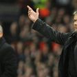 Inter Milan's head coach Jose Mourinho (R) gestures next to Manchester United manager Sir Alex Ferguson during a UEFA Champions League match at Old Trafford in Manchester, in March 2009