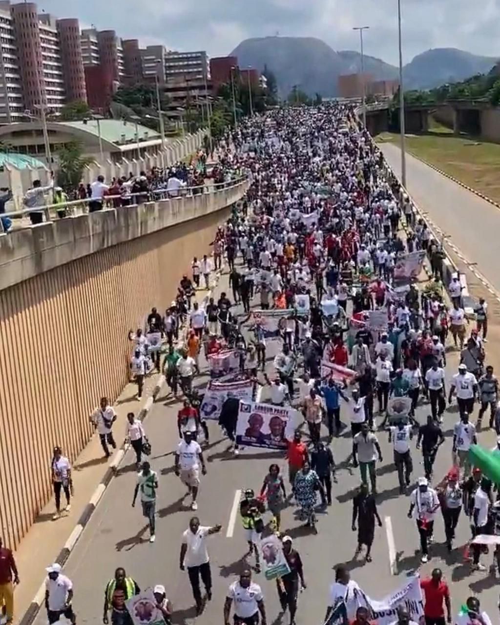 Peter Obi supporters throng Abuja streets for Obidient march .