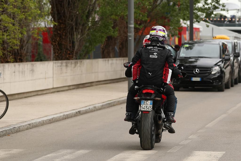 Zhou being taken back to the paddocks on a scooter