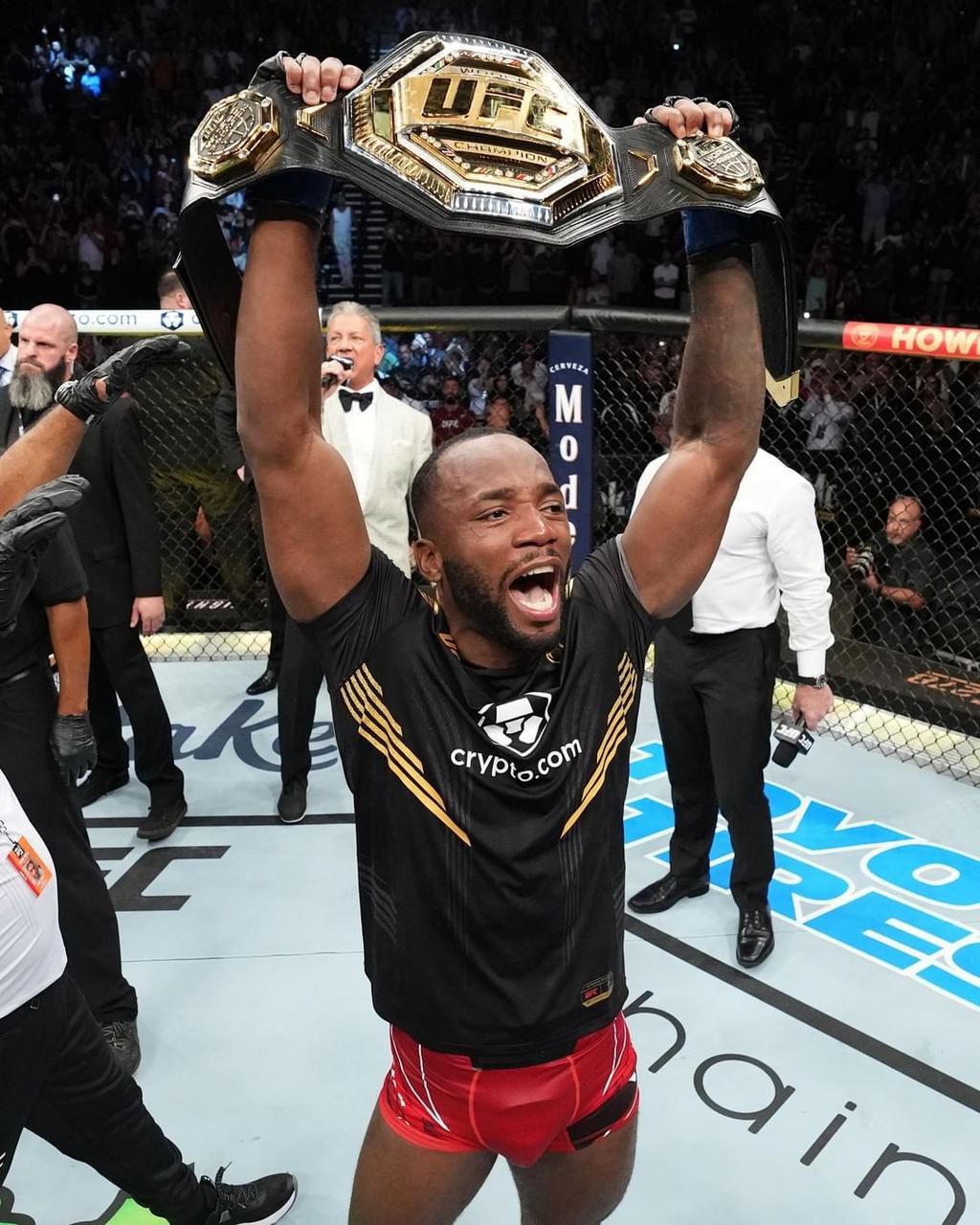 Israel Adesanya celebrates Leon Edwards after knocking out Kamaru Usman at UFC 278