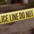 A crime scene cordoned off with police yellow tape