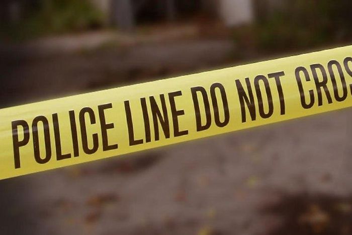 A crime scene cordoned off with police yellow tape