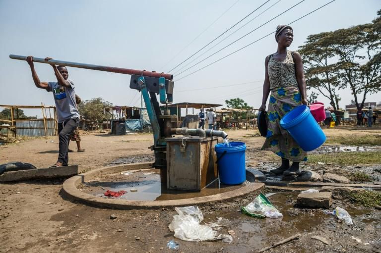 Working class residents like these in the Harare suburb of Glen View rely on water pumped from a boreholes drilled by a donor or city authorities