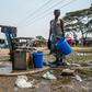 Working class residents like these in the Harare suburb of Glen View rely on water pumped from a boreholes drilled by a donor or city authorities