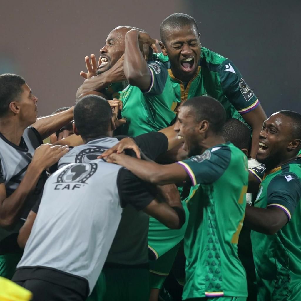 Comoros players celebrate their historic win.
