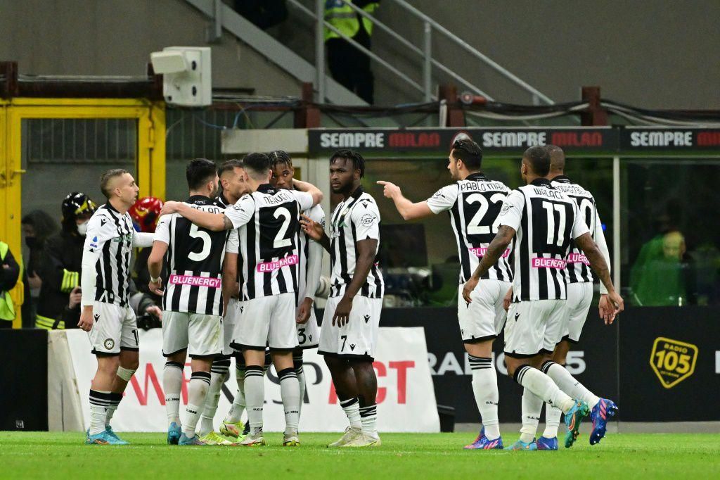 Udinese players celebrate with teammate Destiny Udogie (4L) after his equaliser at the San Siro