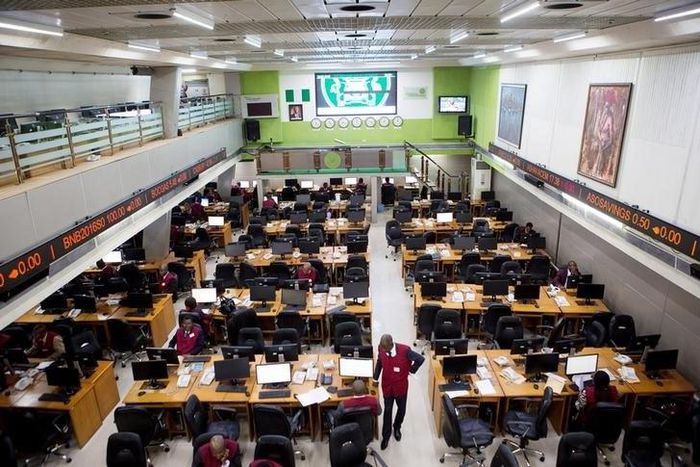 Traders work at the Nigerian Stock Exchange in Lagos