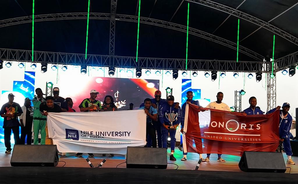 Nile University receives the trophy for second runner-up.