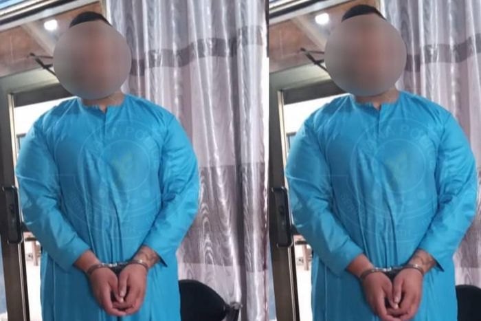 Osman Brustani in handcuffs