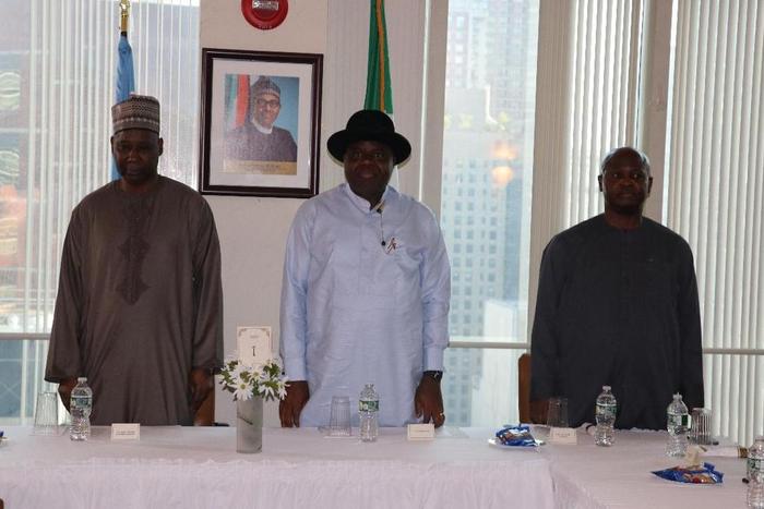 L-R: The Nigeria Permanent Representatives to the UN, Amb. Tijjani Muhammad-Bande, Gov. Douye Diri of Bayelsa and Amb. Lot Egopija, Consul-General of Nigeria in New York, standing to recite the national anthem at a dinner in honour of Diri at Nigeria H...