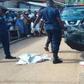 Police carry dead body